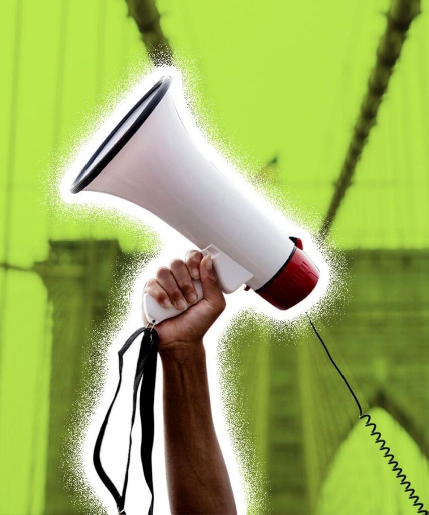 Graphic design illustration from "Screenshot 2026-06-03 at 11.20.18 PM.jpg" featuring a hand holding up a white megaphone with a black and red trim, accented with a rough white sticker-style outline; the graphic is set against a bright lime green tinted background showing the architecture of a large suspension bridge, likely the Brooklyn Bridge—Team DSB Young People Address the Nation case study campaign graphic asset